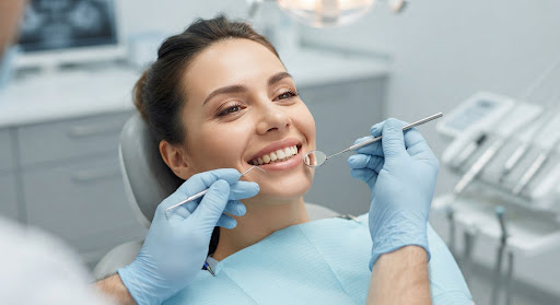 Doctor performing teeth examination